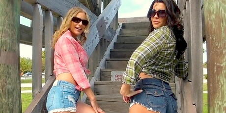 Hot hotties Brianna Ray and Emily Briar in fancy shorts enjoy some playful lesbian action outdoor